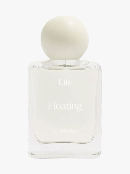 Cream colored bottle of Liis Floating Eau de Parfum on light grey background